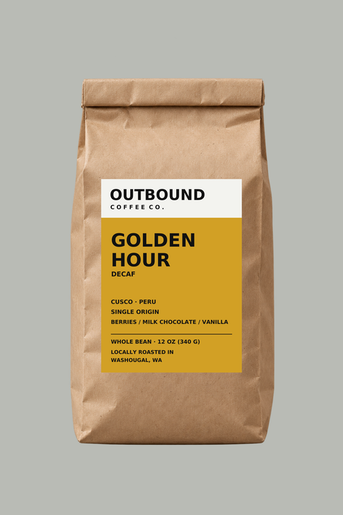 Golden Hour decaf whole bean coffee in Outbound's ochre label bag